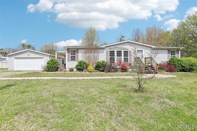 21839 Dove Ln, Carlyle, IL 62231 - view of front of house featuring a detached garage, a front lawn, and an outbuilding
