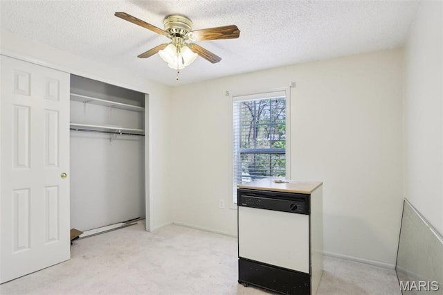 21839 Dove Ln, Carlyle, IL 62231 - unfurnished bedroom with a closet, a textured ceiling, light colored carpet, and a ceiling fan