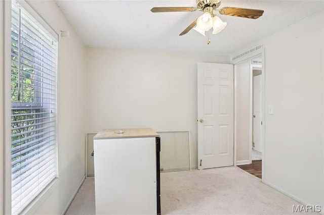 21839 Dove Ln, Carlyle, IL 62231 - unfurnished bedroom with carpet flooring, baseboards, and a ceiling fan