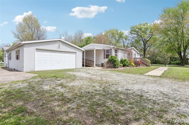21839 Dove Ln, Carlyle, IL 62231 - view of front of home with a garage, a front lawn, and covered porch