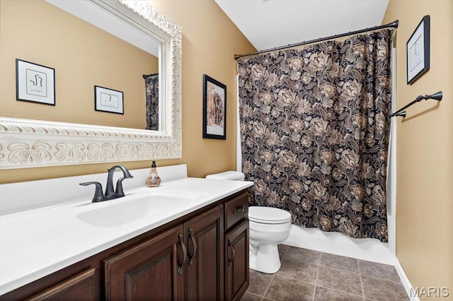 bathroom featuring toilet, vanity, shower / tub combo, and tile patterned floors