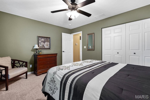 bedroom with light carpet, a closet, baseboards, and ceiling fan