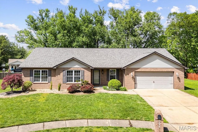 ranch-style home featuring brick siding, a garage, concrete driveway, a front lawn, and roof with shingles