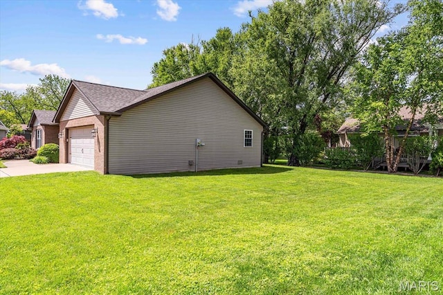 view of side of home with brick siding, a lawn, an attached garage, concrete driveway, and roof with shingles