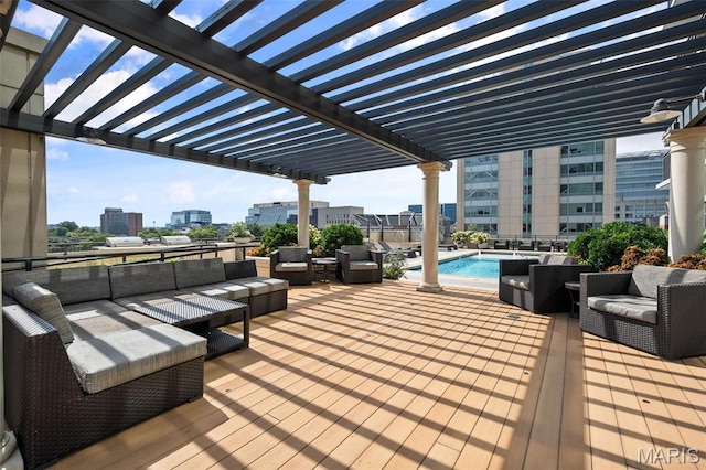 4909 Laclede Ave Unit 805, Saint Louis, MO 63108 - wooden terrace with an outdoor hangout area, a pergola, a city view, and a community pool