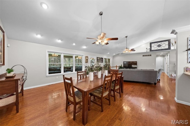 dining space with ceiling fan, vaulted ceiling, wood finished floors, recessed lighting, and baseboards
