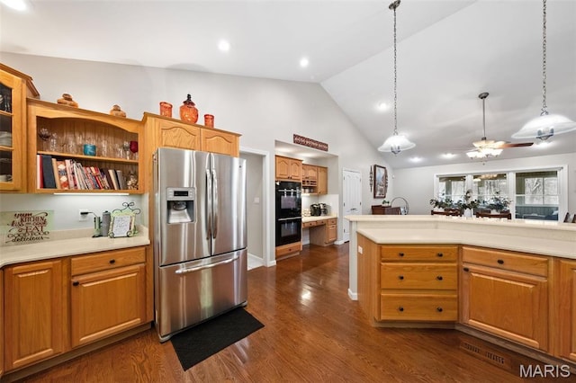 kitchen with stainless steel refrigerator with ice dispenser, light countertops, decorative light fixtures, dark wood-style flooring, and high vaulted ceiling