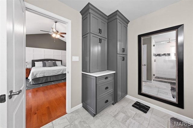 mudroom featuring a ceiling fan and baseboards