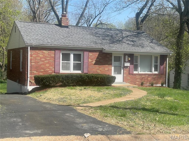 212 S Marguerite, Ferguson, MO 63135 - view of front of property with brick siding, roof with shingles, a front lawn, and a chimney