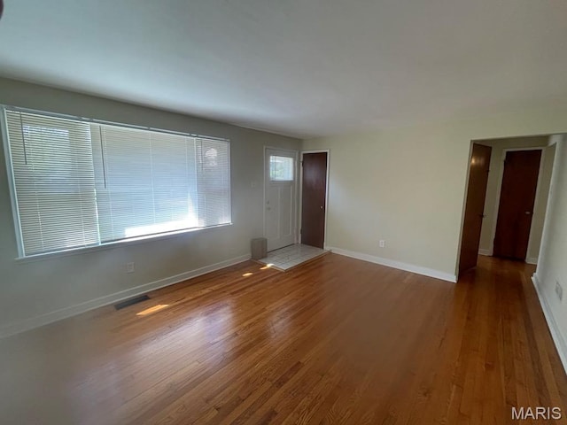 212 S Marguerite, Ferguson, MO 63135 - unfurnished living room with wood finished floors and baseboards