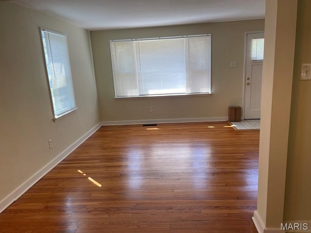 212 S Marguerite, Ferguson, MO 63135 - spare room with wood finished floors and baseboards