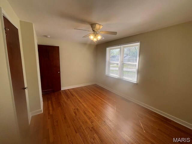 212 S Marguerite, Ferguson, MO 63135 - spare room with wood finished floors, baseboards, ceiling fan, and a smoke detector
