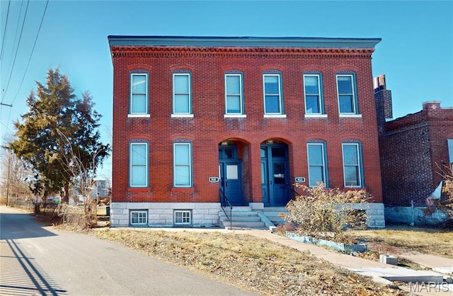 view of front of house featuring brick siding