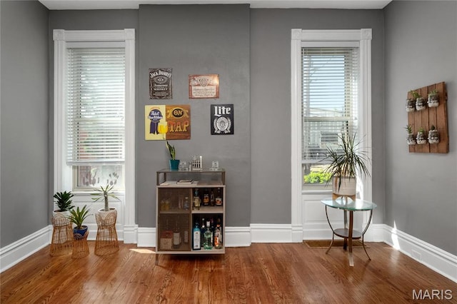 interior space with wood finished floors and baseboards