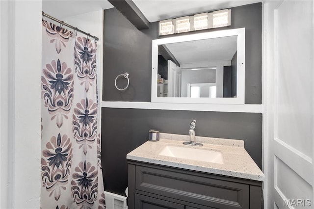 bathroom featuring vanity and a shower with curtain