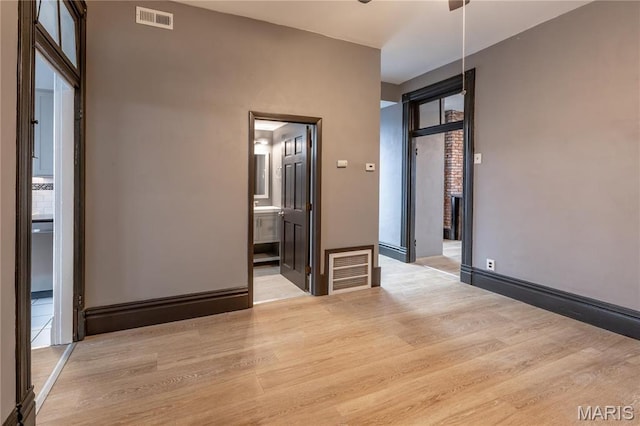 unfurnished room featuring wood finished floors and baseboards