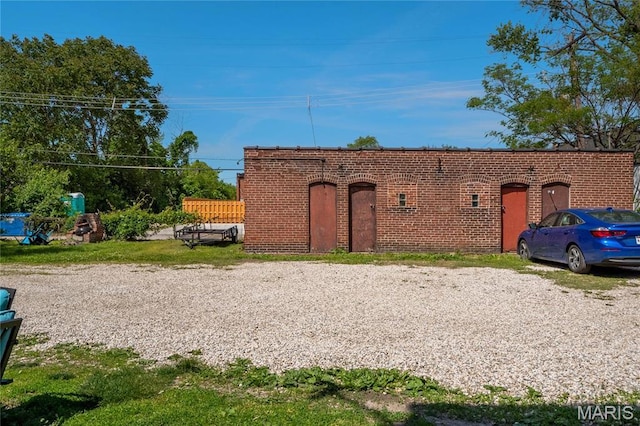 view of front facade featuring brick siding