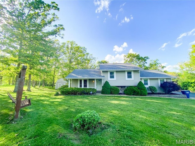 19113 Bent Oak Dr, Warrenton, MO 63383 - split level home featuring a front lawn and a storage unit