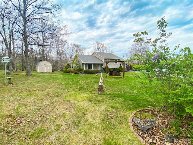 19113 Bent Oak Dr, Warrenton, MO 63383 - view of green lawn with a storage unit