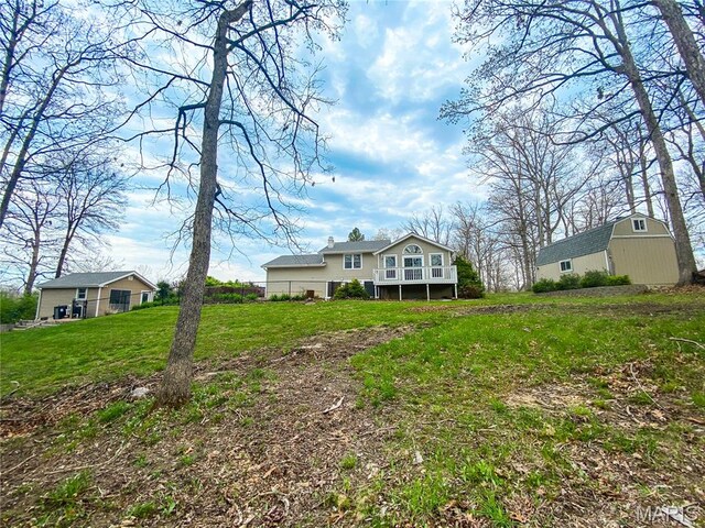 19113 Bent Oak Dr, Warrenton, MO 63383 - rear view of property with an outdoor structure, a yard, and a deck