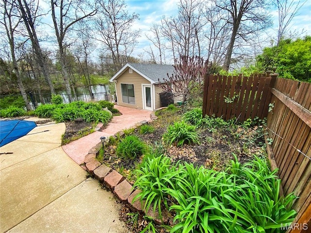 19113 Bent Oak Dr, Warrenton, MO 63383 - fenced backyard featuring an outbuilding and a water view