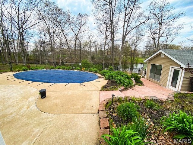 19113 Bent Oak Dr, Warrenton, MO 63383 - view of swimming pool with a patio area, an outdoor structure, and a water view