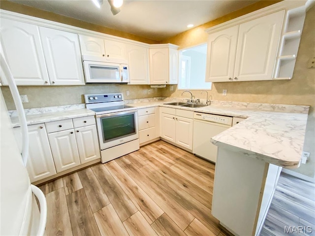19113 Bent Oak Dr, Warrenton, MO 63383 - kitchen with white appliances, a peninsula, light wood-type flooring, white cabinets, and recessed lighting