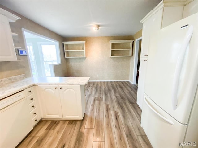19113 Bent Oak Dr, Warrenton, MO 63383 - kitchen with white appliances, light wood-style floors, open shelves, and a peninsula