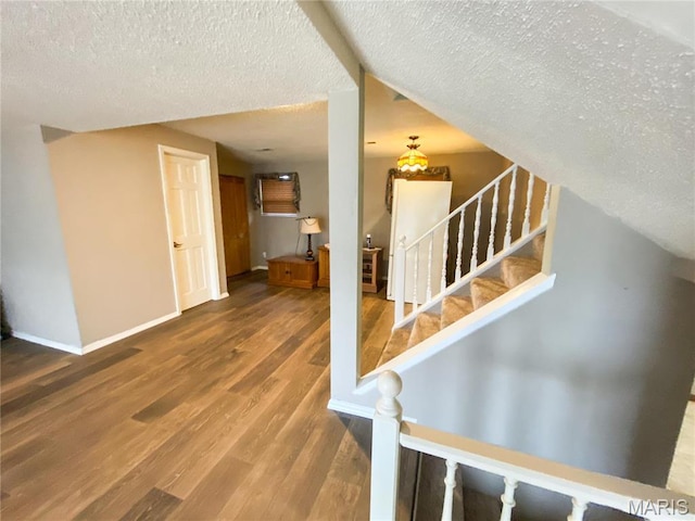 19113 Bent Oak Dr, Warrenton, MO 63383 - stairway featuring wood finished floors and a textured ceiling
