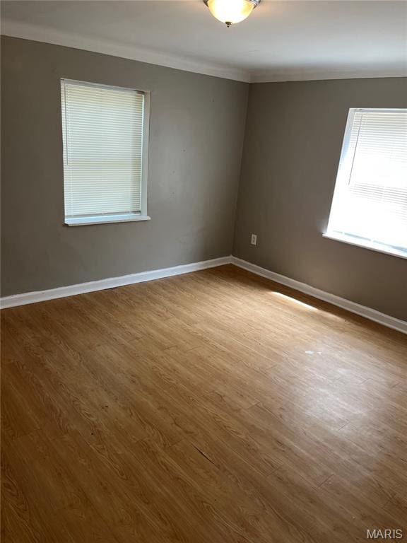 3253 Coles Ave, Saint Louis, MO 63114 - unfurnished room with ornamental molding, wood finished floors, and baseboards