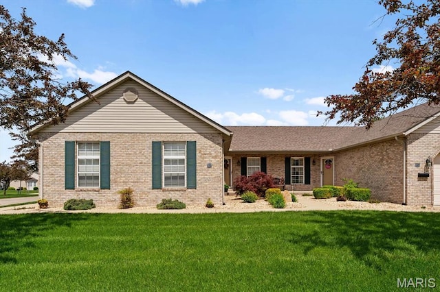 ranch-style home with brick siding and a front lawn