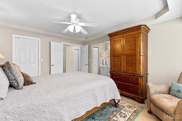 bedroom with a ceiling fan and ensuite bathroom