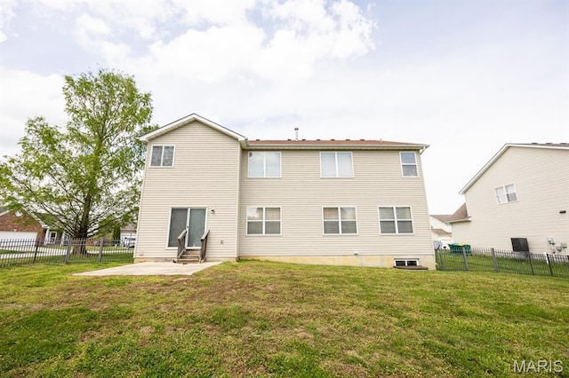 rear view of property with entry steps and a patio