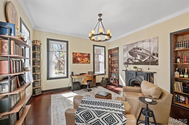 921 Morrison Ave, Saint Louis, MO 63104 - sitting room featuring ornamental molding, a chandelier, a warm lit fireplace, wood finished floors, and a desk