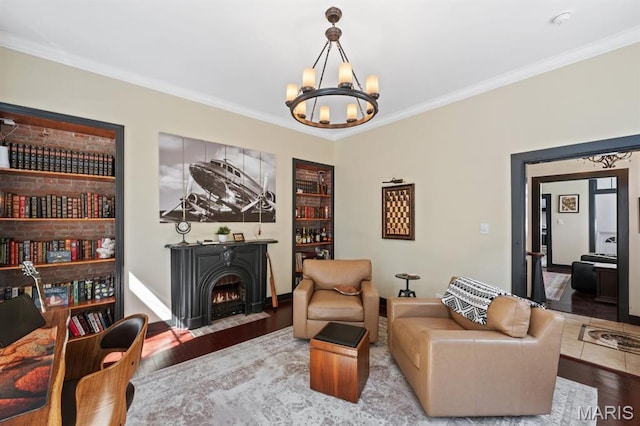 921 Morrison Ave, Saint Louis, MO 63104 - living area with a chandelier, wood finished floors, a fireplace with flush hearth, and crown molding