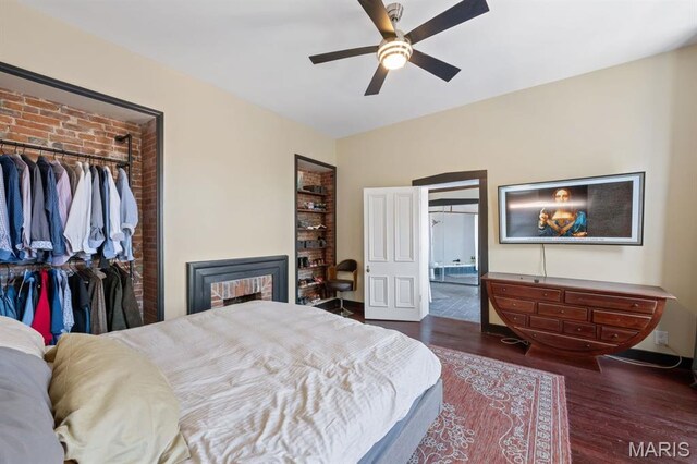 921 Morrison Ave, Saint Louis, MO 63104 - bedroom featuring wood finished floors, a closet, ceiling fan, connected bathroom, and a fireplace