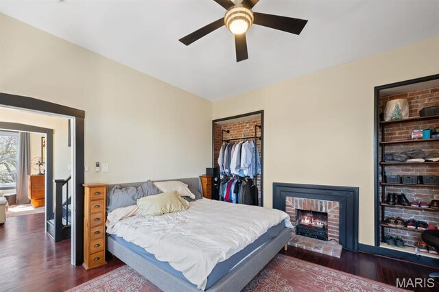 921 Morrison Ave, Saint Louis, MO 63104 - bedroom featuring wood finished floors, a ceiling fan, and a brick fireplace