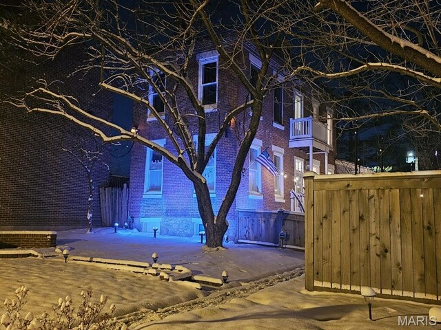 921 Morrison Ave, Saint Louis, MO 63104 - property exterior at night featuring brick siding and fence