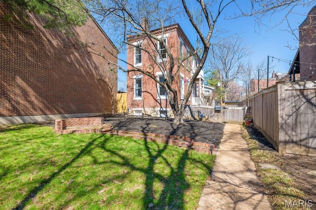 921 Morrison Ave, Saint Louis, MO 63104 - view of side of property with a chimney and brick siding