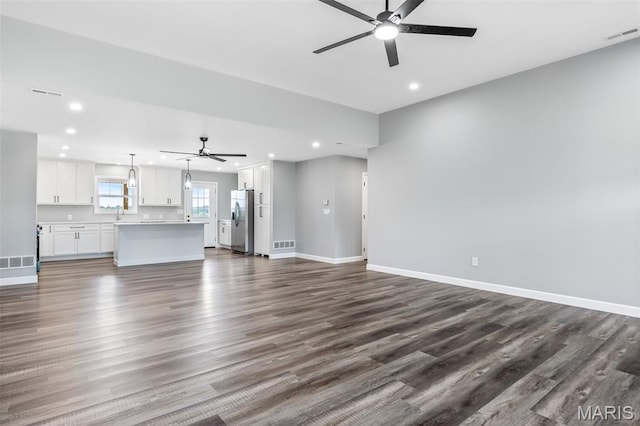 208 Ariel Ct, Desloge, MO 63601 - unfurnished living room featuring a ceiling fan, recessed lighting, dark wood finished floors, and baseboards
