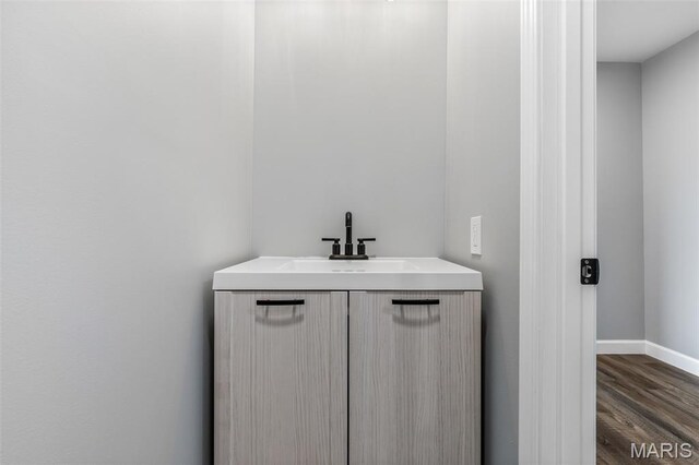 208 Ariel Ct, Desloge, MO 63601 - bathroom featuring baseboards, wood finished floors, and vanity