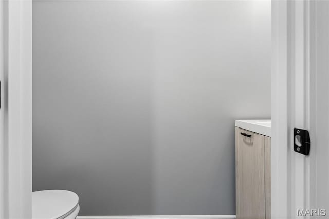 208 Ariel Ct, Desloge, MO 63601 - bathroom featuring toilet, vanity, and baseboards