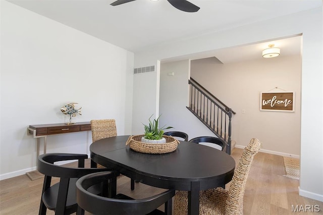 1739 Naughton Way, Swansea, IL 62226 - dining area with stairs, light wood-style flooring, baseboards, and ceiling fan