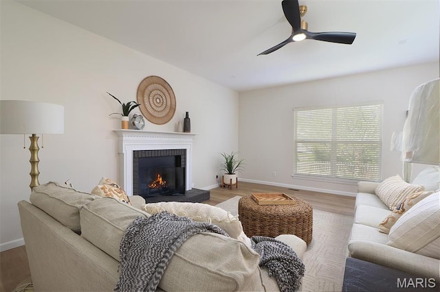1739 Naughton Way, Swansea, IL 62226 - living room with a brick fireplace, wood finished floors, a ceiling fan, and baseboards