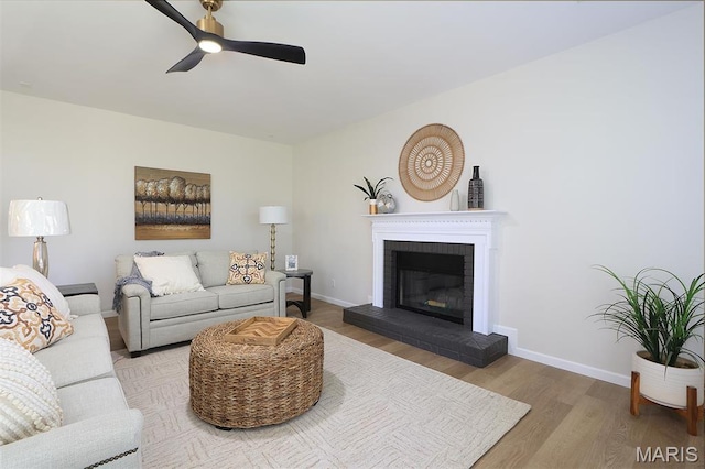 1739 Naughton Way, Swansea, IL 62226 - living room with wood finished floors, ceiling fan, baseboards, and a brick fireplace
