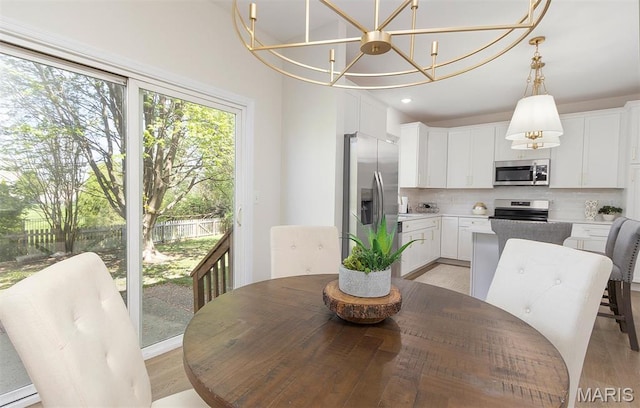 1739 Naughton Way, Swansea, IL 62226 - dining room with a chandelier, light wood-style flooring, and recessed lighting