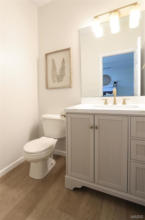 1739 Naughton Way, Swansea, IL 62226 - bathroom with wood finished floors, baseboards, toilet, and vanity