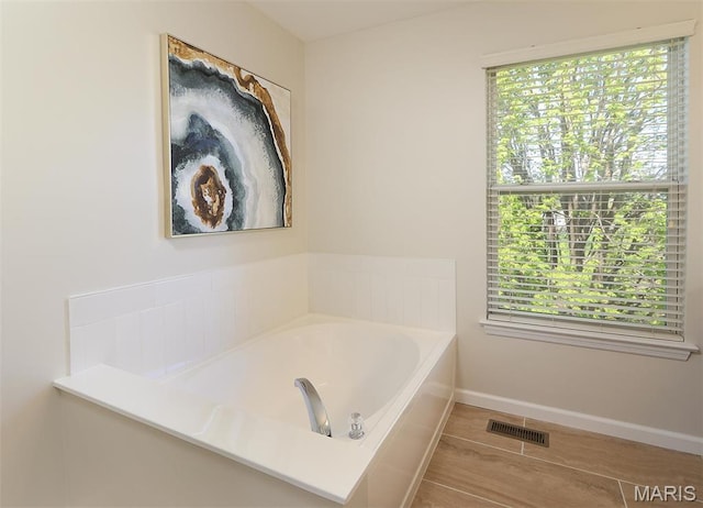 1739 Naughton Way, Swansea, IL 62226 - bathroom featuring a bath and baseboards