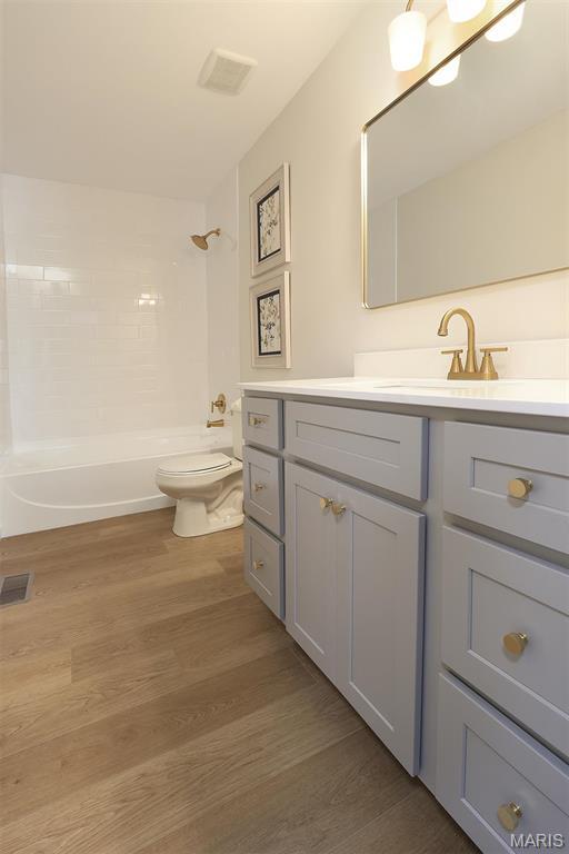 1739 Naughton Way, Swansea, IL 62226 - full bath with toilet, vanity, shower / bath combination, and wood finished floors