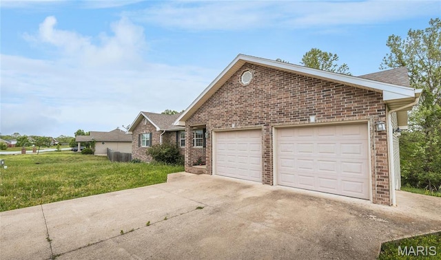 19252 Lambert Ln, Waynesville, MO 65583 - view of front of home featuring brick siding, an attached garage, concrete driveway, and a front lawn